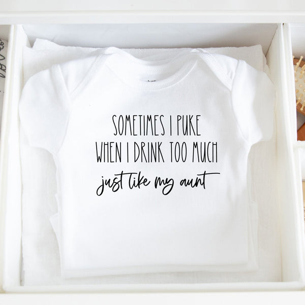 Sometimes I Puke When I Drink Too Much - Just Like My Aunt baby bodysuit lifestyle photo - white bodysuit folded in a dresser drawer