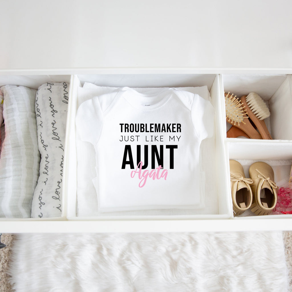 Troublemaker, Just Like My Aunt personalized baby bodysuit lifestyle photo - white bodysuit folded in a dresser drawer