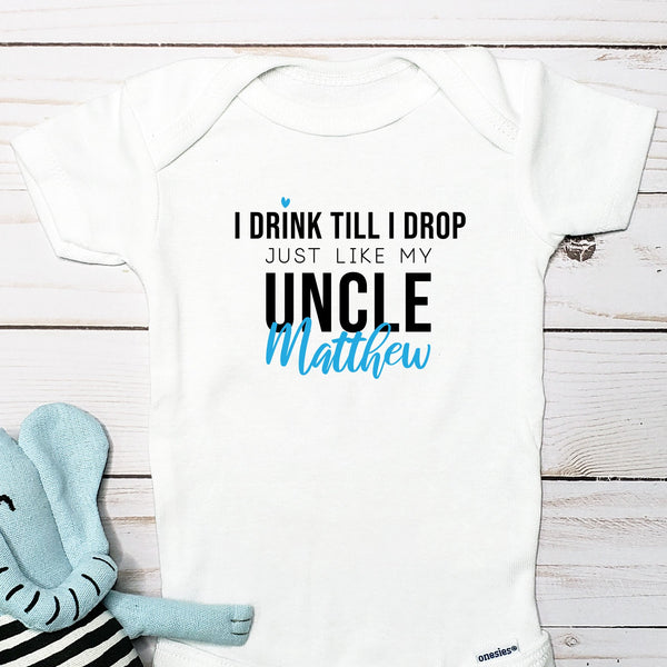I Drink Till I Drop, Just Like My Uncle personalized baby bodysuit lifestyle photo - white bodysuit displayed near elephant nursery decor
