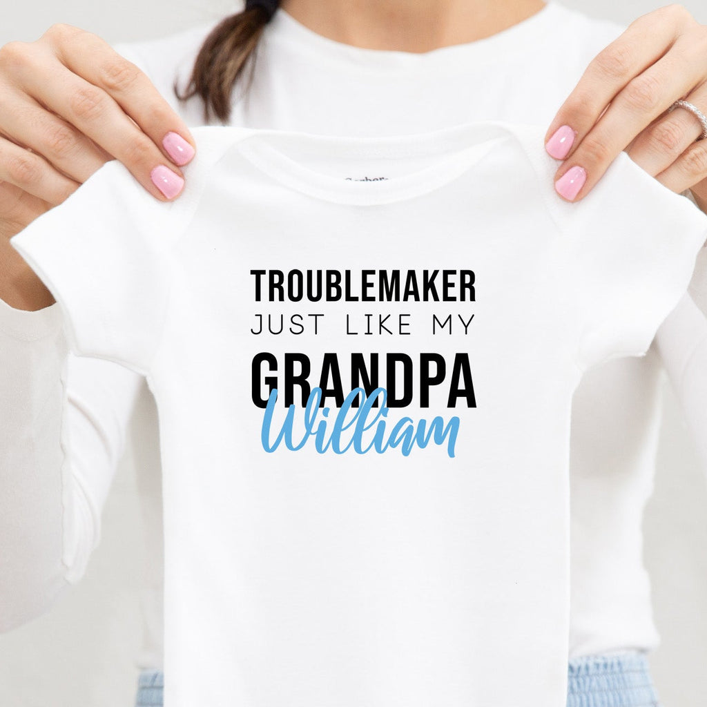 Troublemaker, Just Like My Grandpa personalized baby bodysuit lifestyle photo - white bodysuit being held by a woman