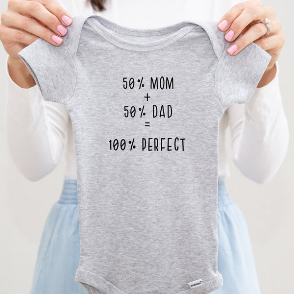 50% Mom, 50% Dad = 100% Perfect baby bodysuit lifestyle photo - gray bodysuit being held by an adult