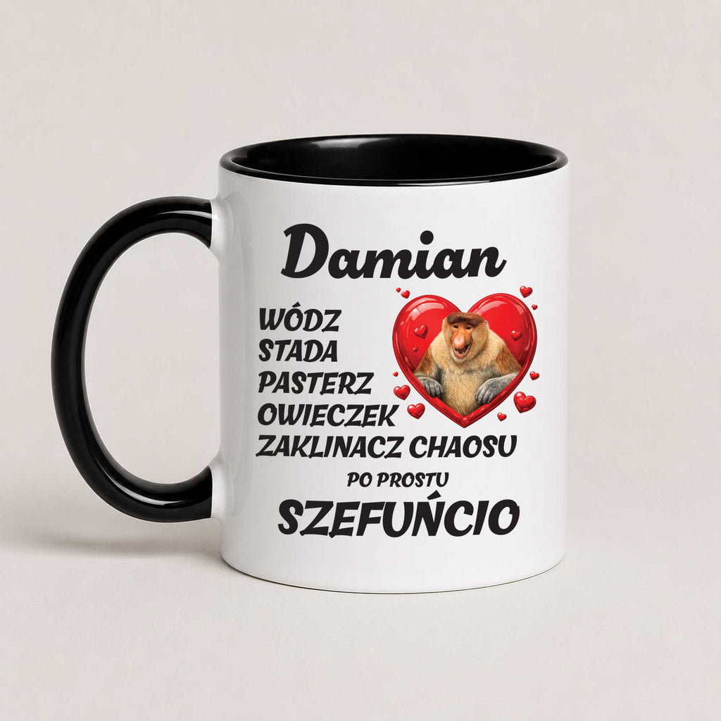 A white ceramic mug with a black handle and black interior, printed with Polish text and a cartoon bearded dragon inside a red heart. The mug is photographed on a plain light beige background.