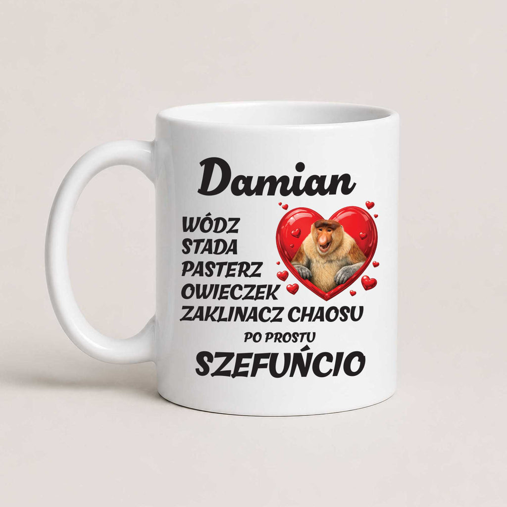 A white ceramic coffee mug with a humorous Polish inscription and a cartoon graphic of a bearded dragon inside a red heart, set against a plain light beige background.
