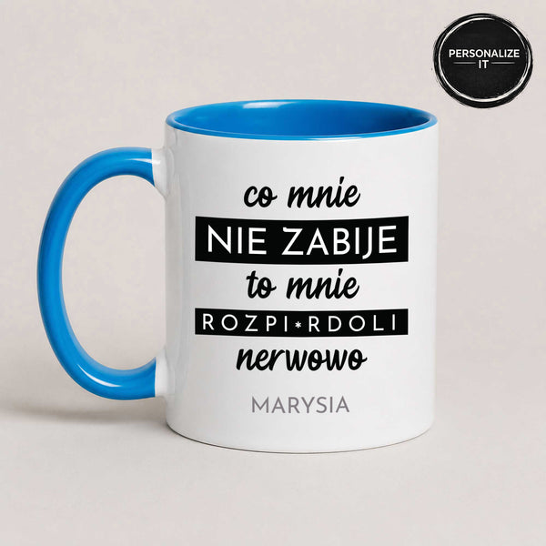 Close-up view of a Blue 11oz ceramic Polish coffee mug featuring a custom name and the bold quote 'Co mnie nie zabije, to mnie rozpierdoli nerwowo'