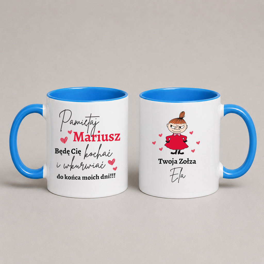 Two white ceramic mugs with blue interiors and handles, shown side by side on a light gray background. The left mug has Polish text reading 'Pamiętaj Mariusz' with red and black lettering and small pink hearts.