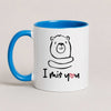 A Blue 11oz ceramic mug with a hand-drawn bear illustration and the text 'I Miś You' with a small red heart