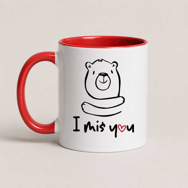 A Red 11oz ceramic mug with a hand-drawn bear illustration and the text 'I Miś You' with a small red heart