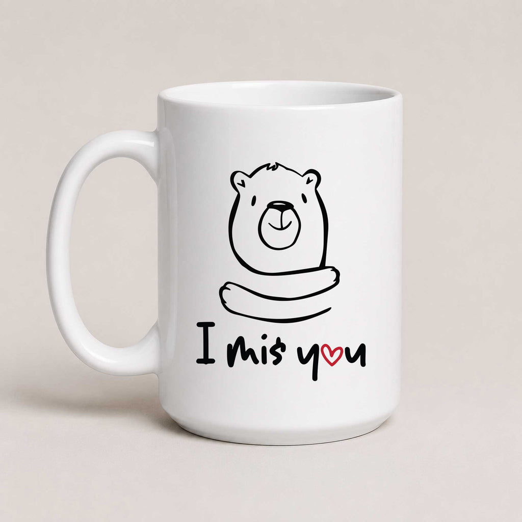 A White 15oz ceramic mug with a hand-drawn bear illustration and the text 'I Miś You' with a small red heart