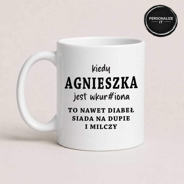 White 11oz personalized Polish mug reading 'Kiedy [Imię] jest wkur#iona' with a 'Personalize It' badge showing customers can add any name