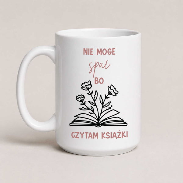 Polish book lover mug reading 'Nie mogę spać, bo czytam książki' with hand-drawn book and flowers illustration, white 15oz mug
