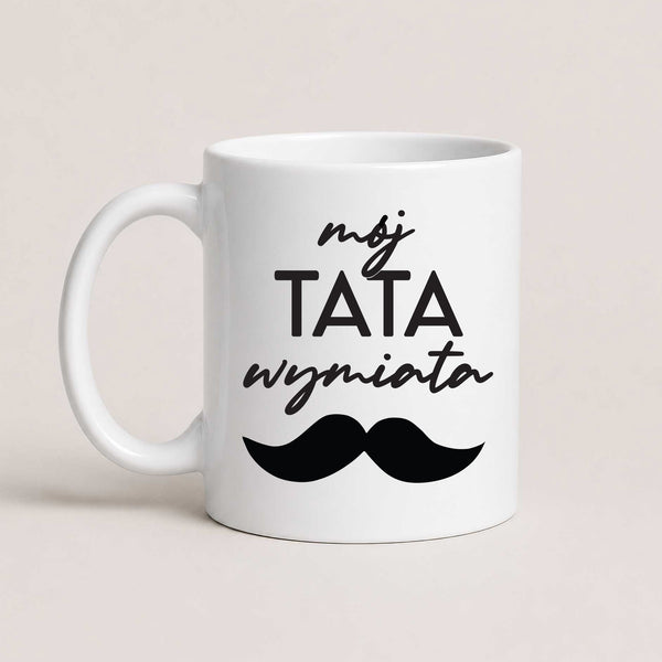 A White 11oz ceramic Polish coffee mug featuring the bold 'Mój Tata Wymiata' design