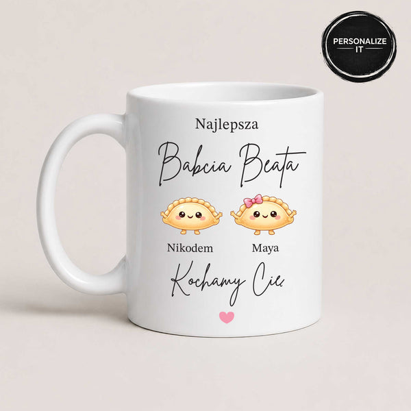 Close-up view of a White 11oz ceramic Polish coffee mug featuring the 'Najlepsza Babcia' message, pierogi illustrations, and custom grandchildren's names
