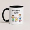 A Black 11oz ceramic Polish coffee mug featuring custom grandchildren illustrations, names, and the message 'Kochamy Cię Babciu'