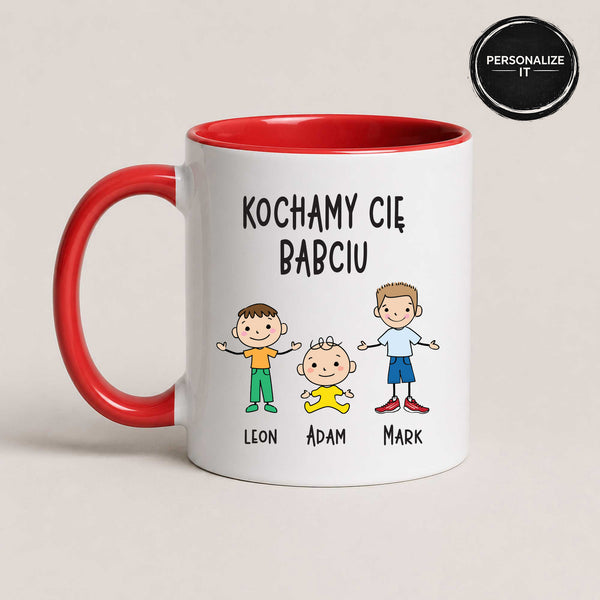 Close-up view of a Red 11oz ceramic Polish coffee mug featuring custom grandchildren illustrations, names, and the message 'Kochamy Cię Babciu'