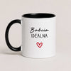 A Black 11oz ceramic Polish coffee mug featuring the 'Babcia Idealna' design with a delicate heart accent