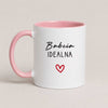 A Pink 11oz ceramic Polish coffee mug featuring the 'Babcia Idealna' design with a delicate heart accent