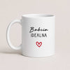 A White 11oz ceramic Polish coffee mug featuring the 'Babcia Idealna' design with a delicate heart accent