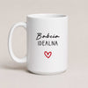 A White 15oz ceramic Polish coffee mug featuring the 'Babcia Idealna' design with a delicate heart accent
