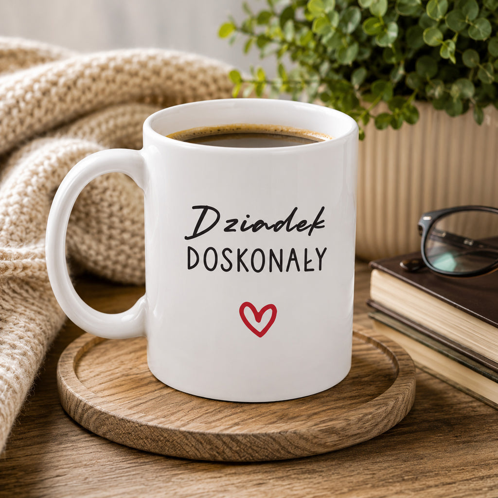 Lifestyle photo of the Polish mug featuring the 'Dziadek Doskonały' design with a subtle heart accent