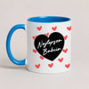 A Blue 11oz ceramic Polish coffee mug featuring the 'Najlepsza Babcia' design with a bold black heart and red heart pattern