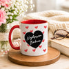 Lifestyle photo of the Polish mug featuring the 'Najlepsza Babcia' design with a bold black heart and red heart pattern