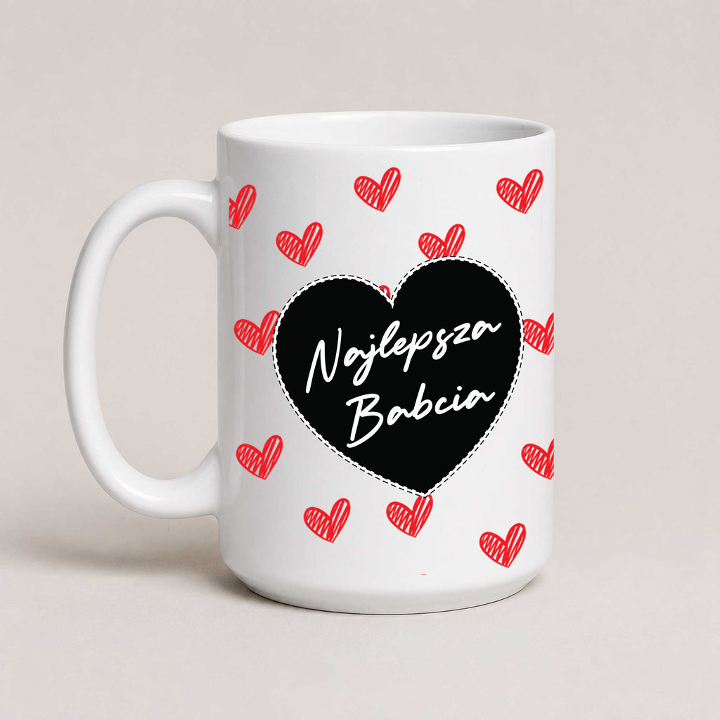 A White 15oz ceramic Polish coffee mug featuring the 'Najlepsza Babcia' design with a bold black heart and red heart pattern