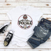 Woman wearing a white POLSKA Polish folk art mountain emblem t-shirt with red and black ornaments and edelweiss
